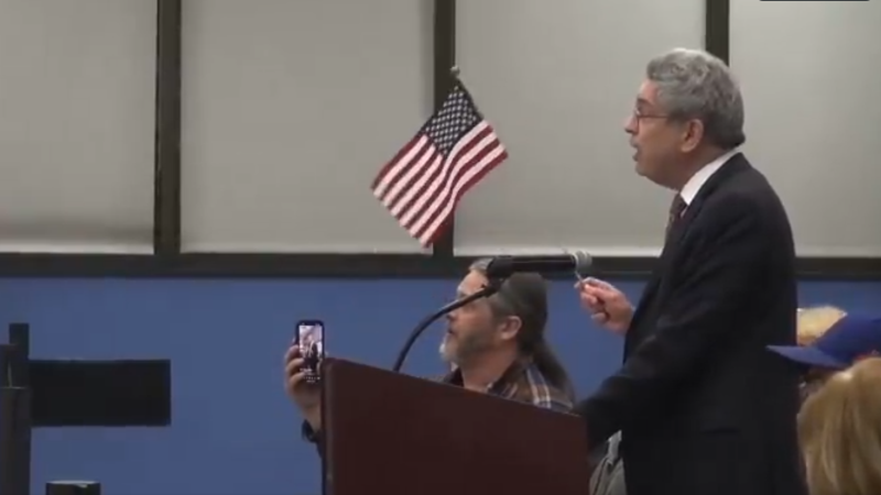 Man Escorted Out Of Town Council Meeting For Holding American Flag & US Constitution After City Banned Speakers From Using “Props”
