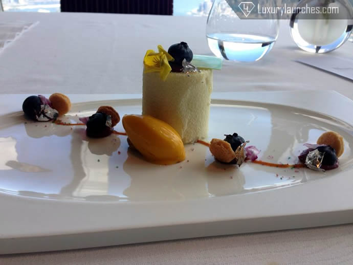 White chocolate yogurt mousse with cassis crème almonds, raspberry jam and mango sorbet