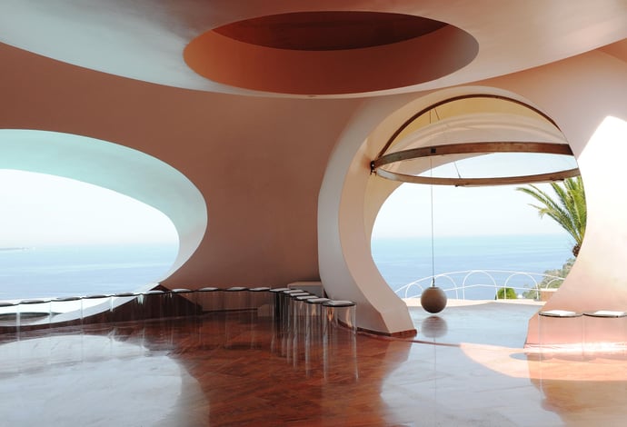 Perched on the cliffs of Théoule-sur-Mer, the PalaisBulles (Bubble Palace) is organic and avant-garde, a stark contrast to the more visible concrete and straight lined industrial expression.