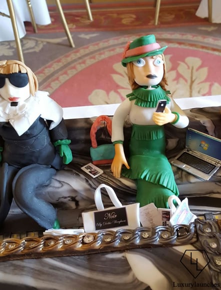 characters front row with laptops and camera phone