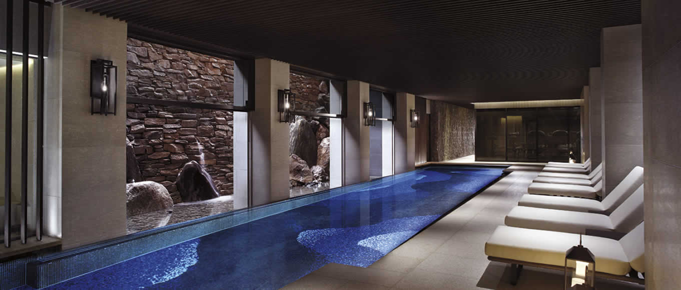 The indoor swimming pool with a Zen rock wall