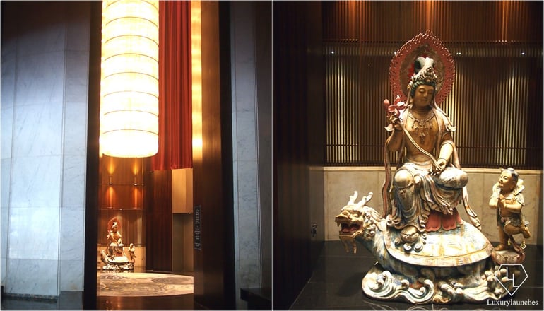 Elevator waiting area with Guan Yin and crystal chandelier