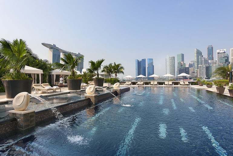 The outdoor swimming pool offers an oasis from the humid heat