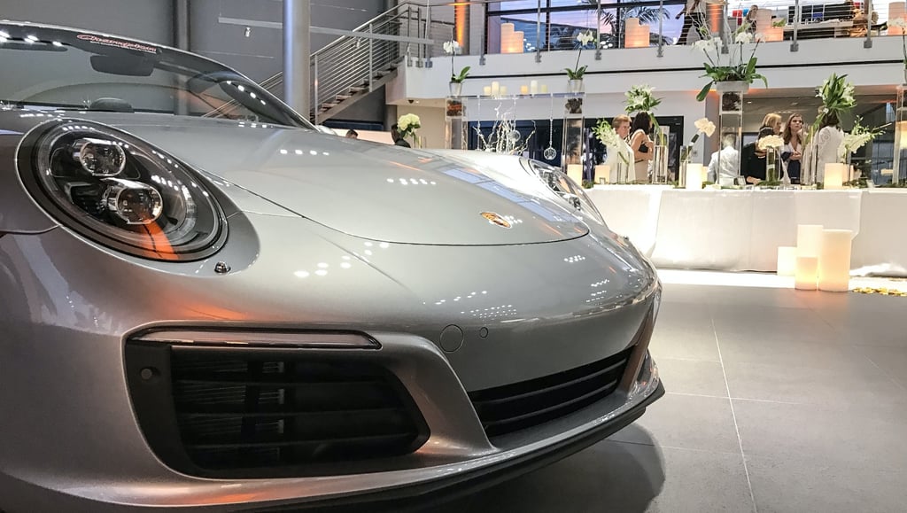 married-in-a-porsche-showroom-1