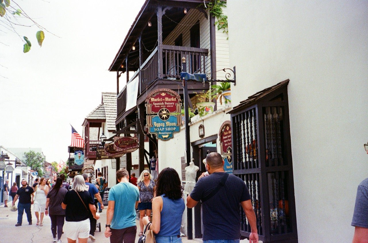 People walking along a shopping street in St. Augustine.