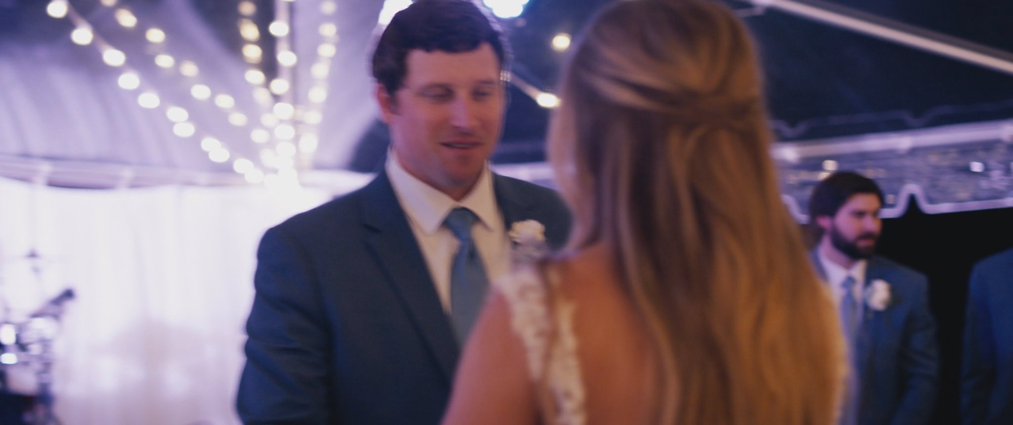 Montana and Cam dancing at the reception. Still from their Midsummer Productions wedding film.