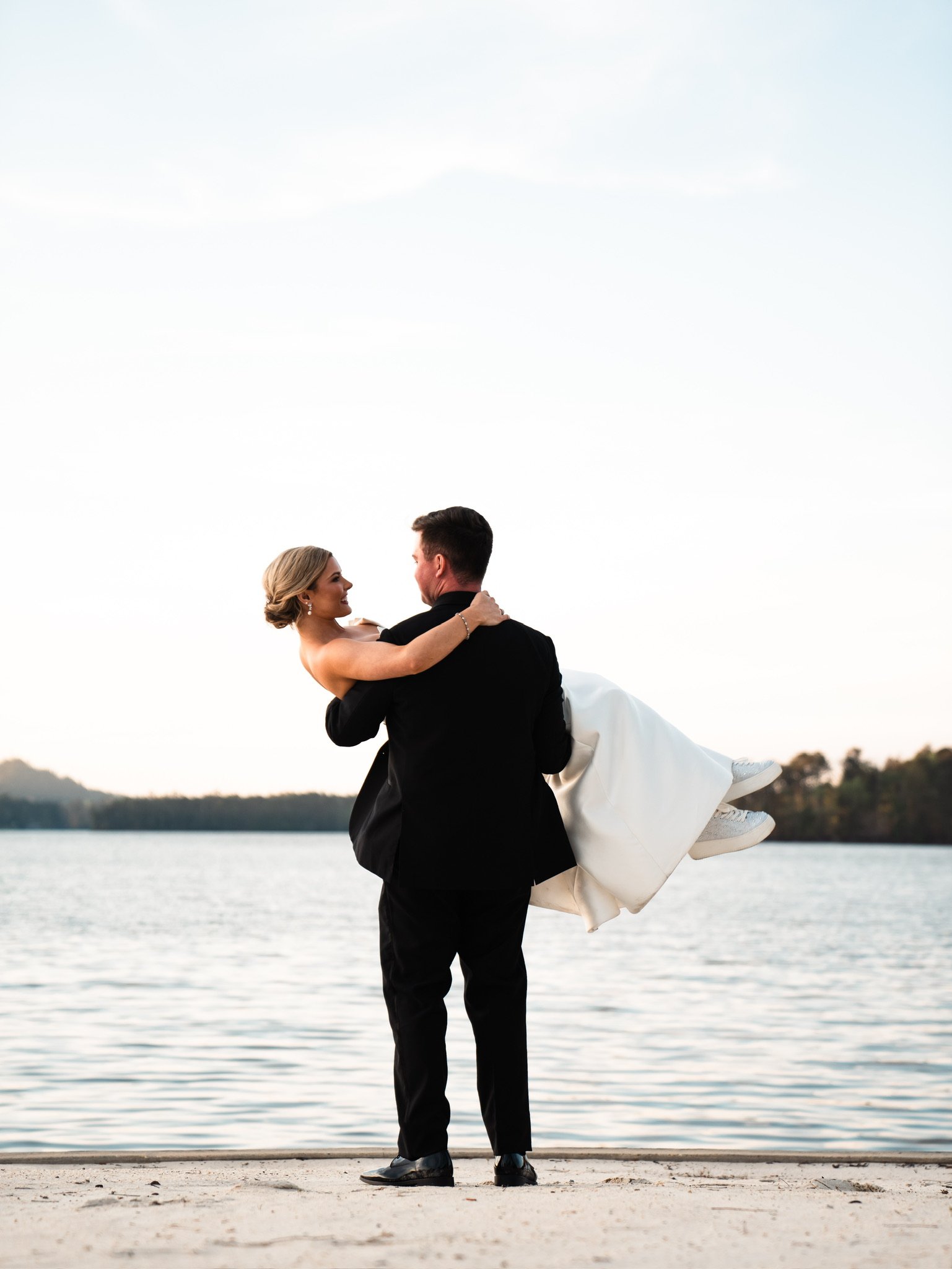 Will carrying Mollie by the lake.