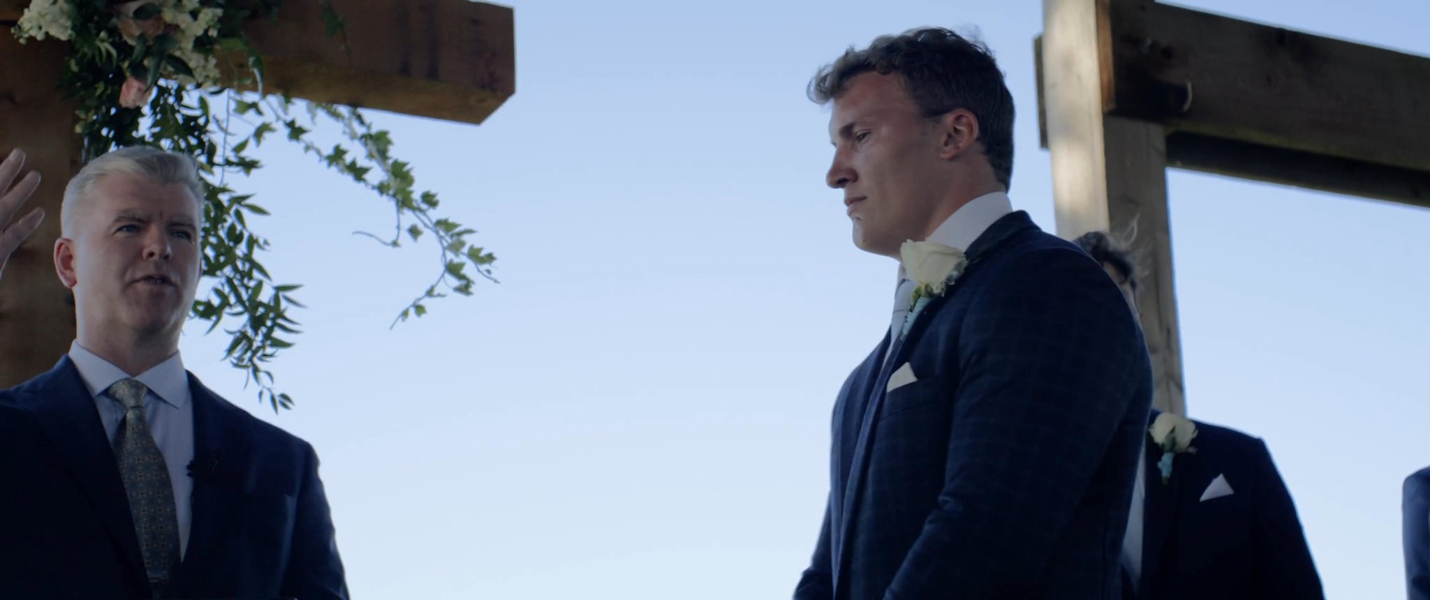 Jake listening at the ceremony. Still from their Midsummer Productions wedding film.