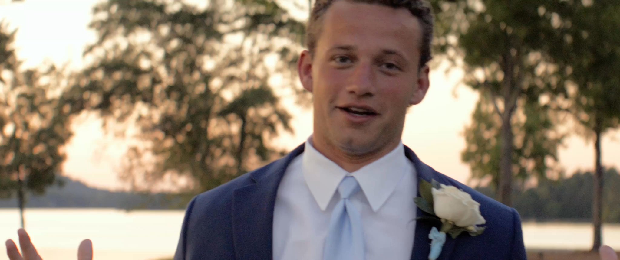 Jake in his tuxedo in the evening light. Still from their Midsummer Productions wedding film.