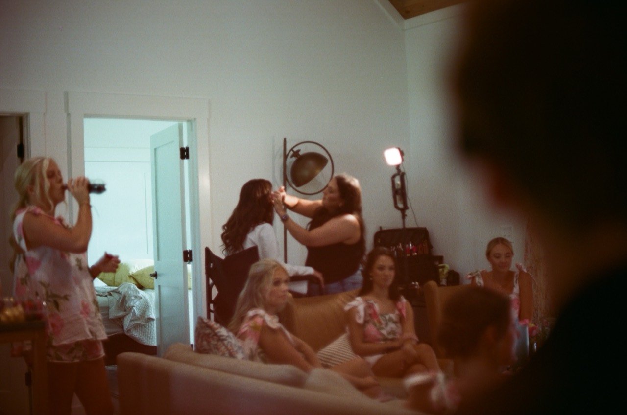 Brooklyn and her bridesmaids in the getting-ready room at New Water Farms, photographed on film.