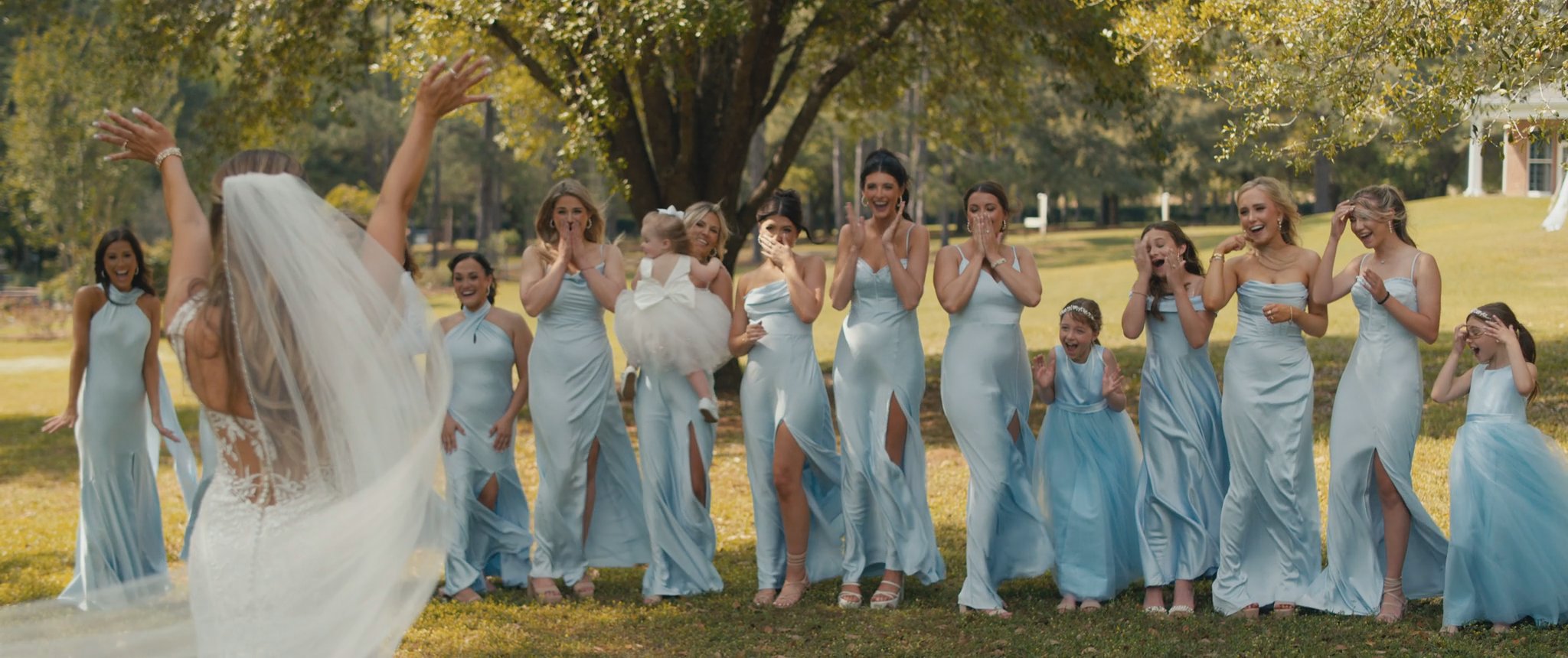 Montana’s bridesmaids react to her wedding dress. Still from their Midsummer Productions wedding film.