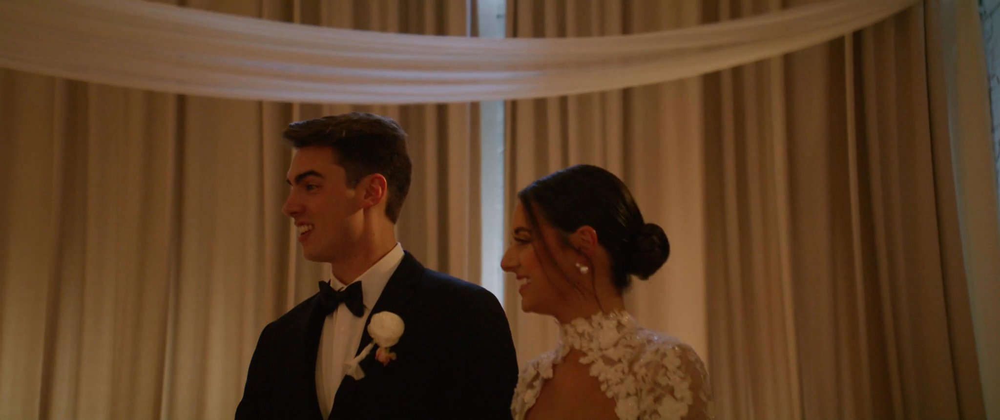 Ally and Jake together in the reception room at Hotel Haya. Still from their Midsummer Productions wedding film.