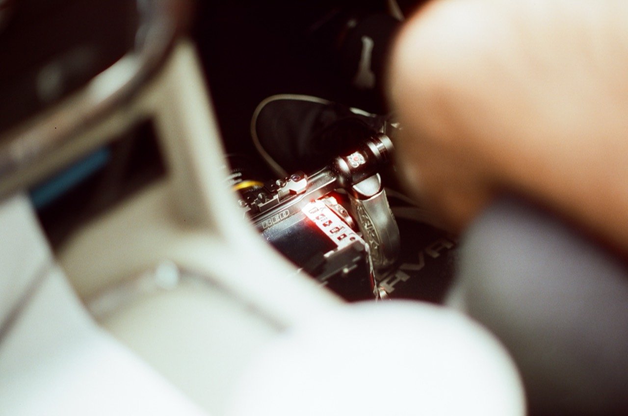 Camera equipment tucked inside a vehicle during Raley’s Miami trip, photographed on film.