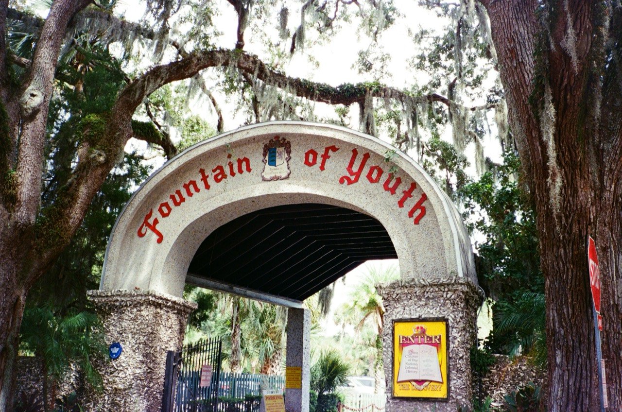 The Fountain of Youth entrance beneath oak trees.