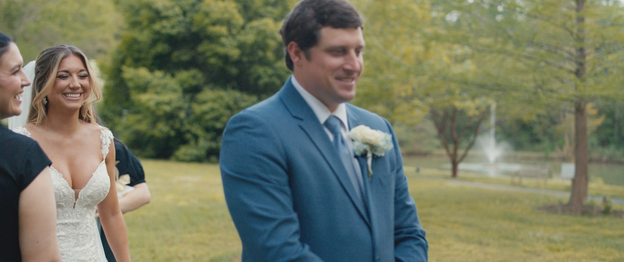 Cam smiles when he sees Montana at their first look. Still from their Midsummer Productions wedding film.
