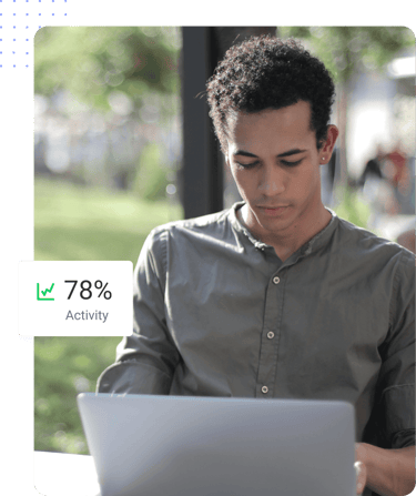 Man working on laptop outdoors with productivity tracker showing 78% activity.