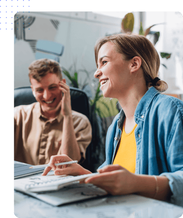 Employees in an office engage in workforce management and productivity planning