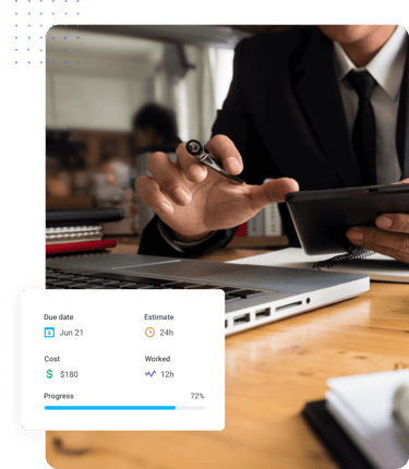 Man calculating state overtime hours using computer, tablet, and Hubstaff software | Hubstaff