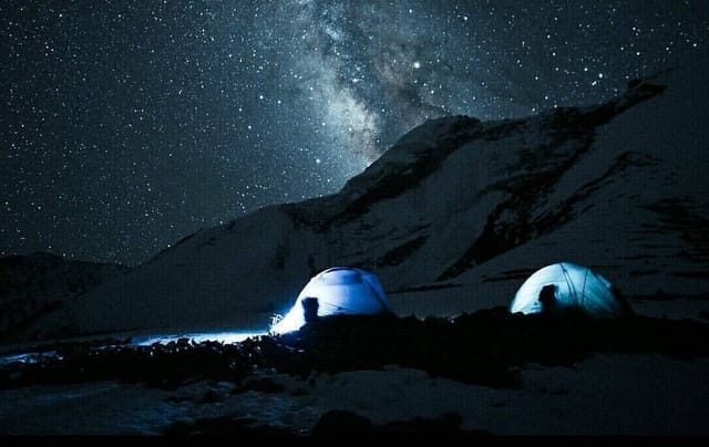 Mountain campsite under the Milky Way at night