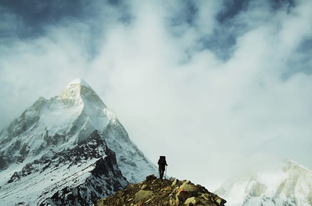 Trekker with Shivling backdrop