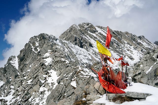 Indrahar Pass Trek Prayer flags at the top