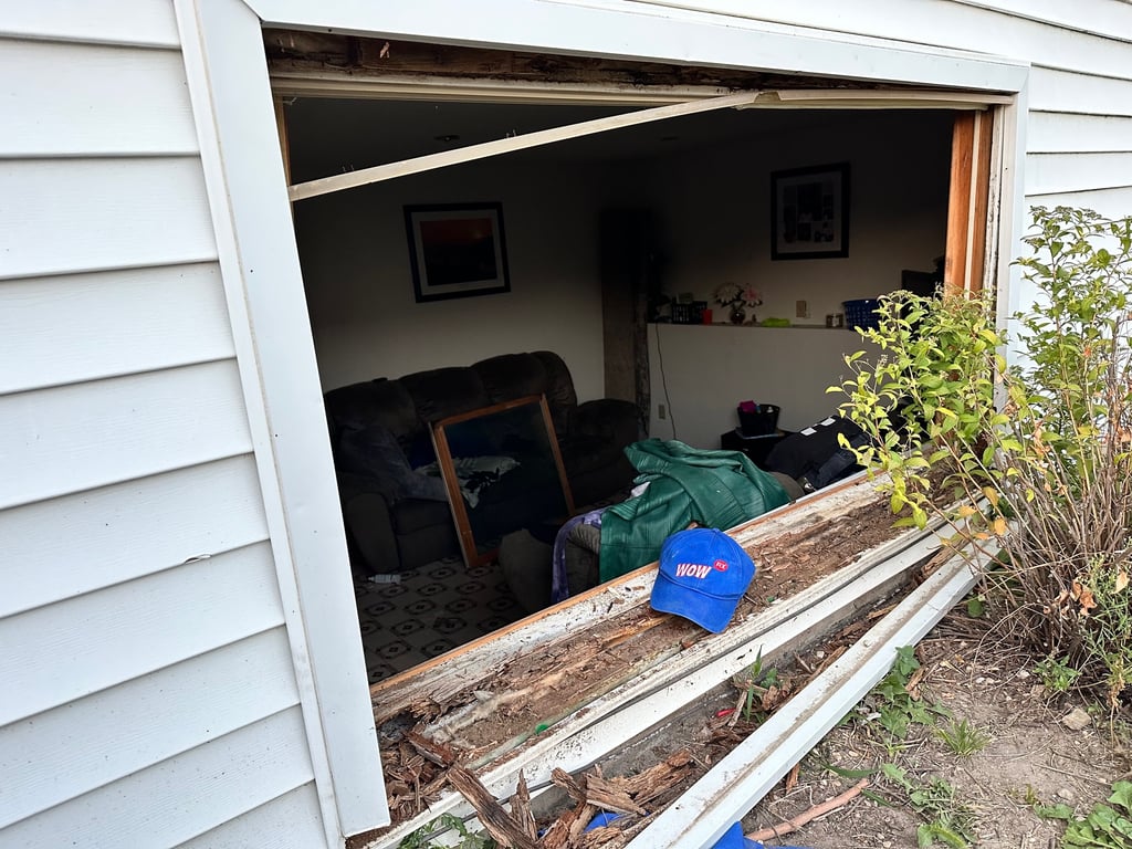 Severely damaged window frame showing wood rot and deterioration, demonstrating need for professional window replacement in Charlotte