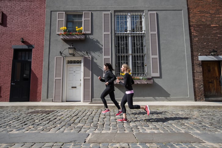 Two runners training on the road