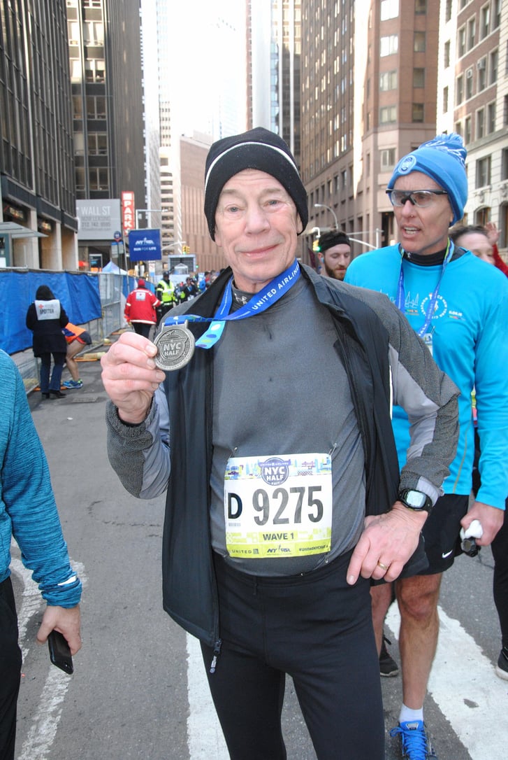 A runner with a finisher medal at the United Airlines NYC Half