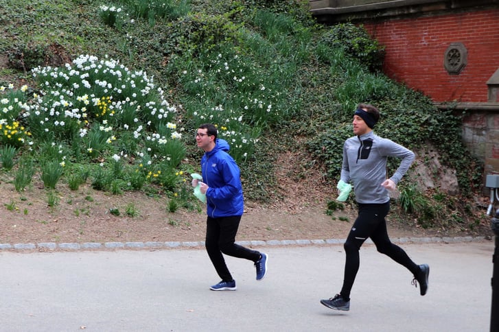 Two runners plogging in Central Park