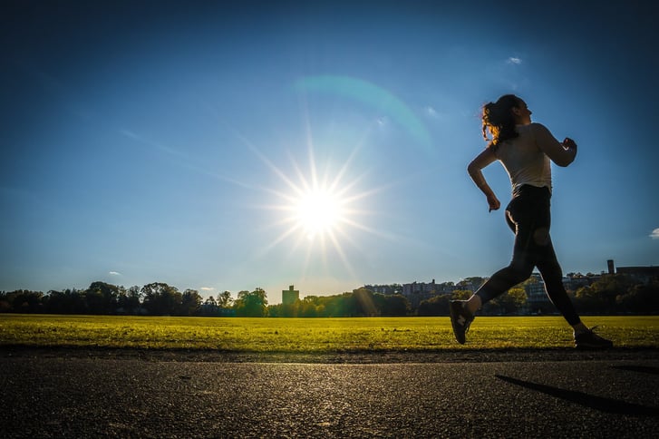 A silhouetted runner in Van Cortlandt Park