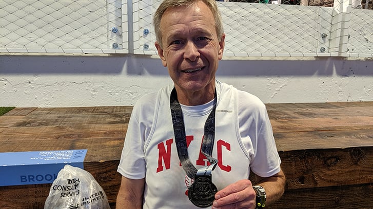 Popular Brooklyn Half Finisher Dempsey with his medal
