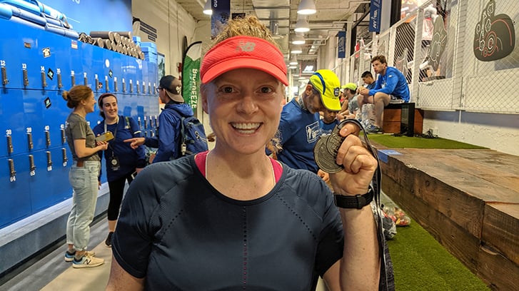 Popular Brooklyn Half Finisher Emera with her medal