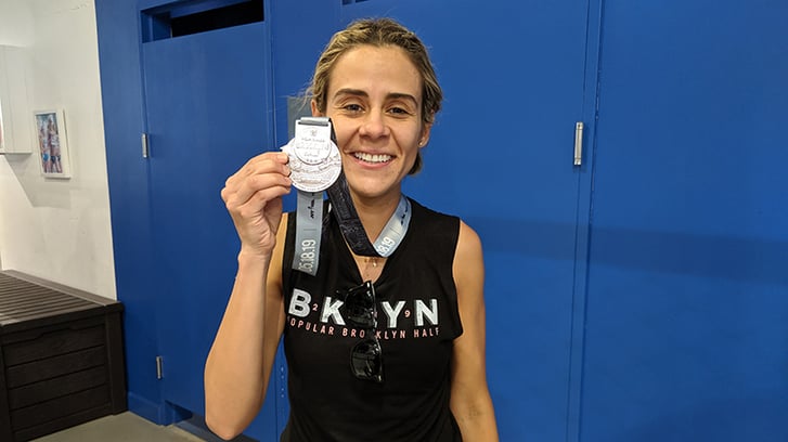 Popular Brooklyn Half Finisher Juliana with her medal