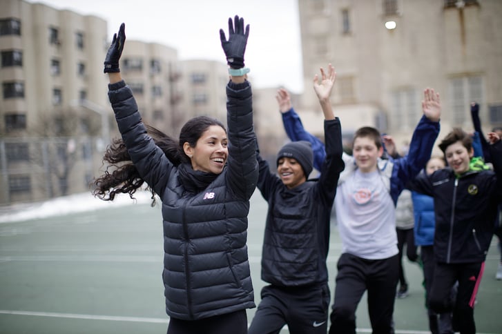 Beverly Ramos showing Rising New York Road Runner participants different exercises