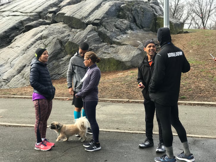Olga, far left, and Rolando, orange shirt, welcome participants and puppies before Open Run