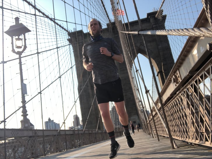 A runner crossing the Brooklyn Bridge