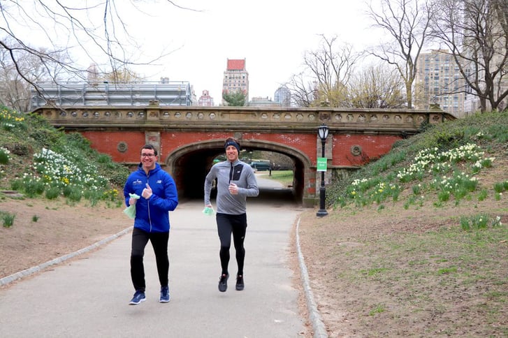 Two runners plogging in Central Park