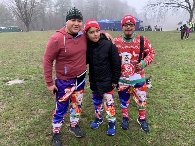 three men running jingle bell jog in cat pants