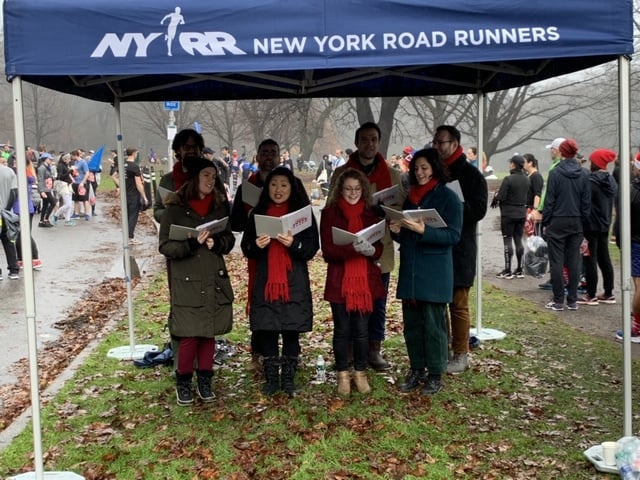 carolers at finish of jingle bell jog