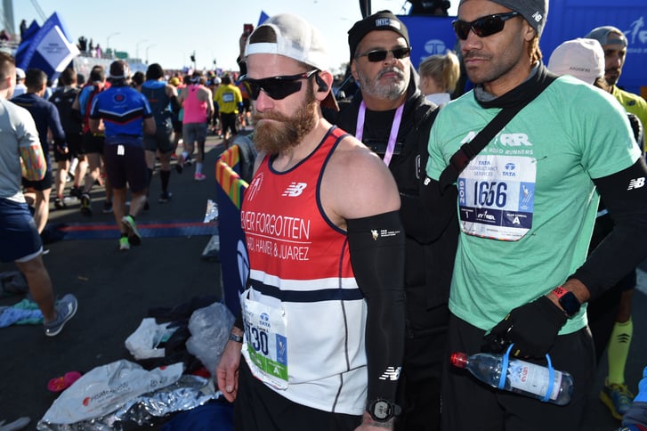 Micah Herndon, left, and his coach Roberto Mandje of NYRR, at the start of the TCS NYC Marathon.