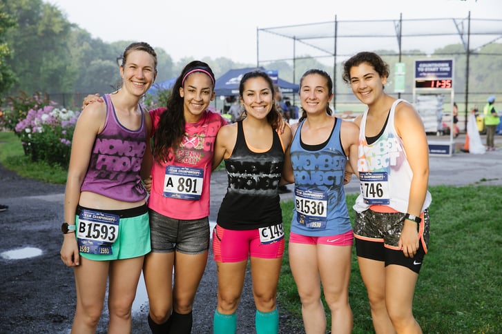The November Project club runners posing after a race
