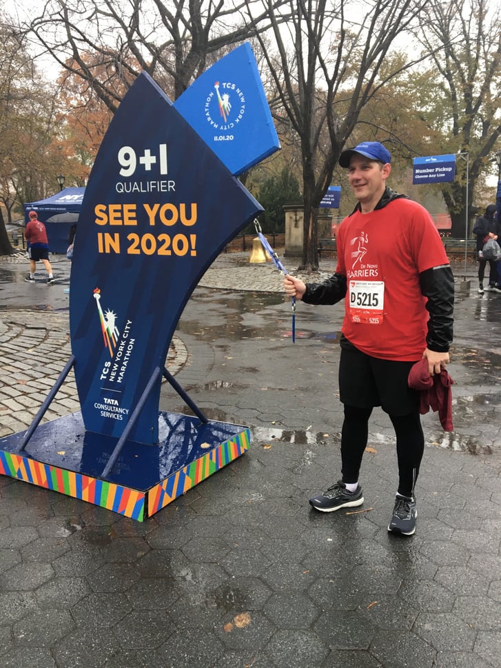 Runner ringing 9+1 bell at 2019 Race to Deliver