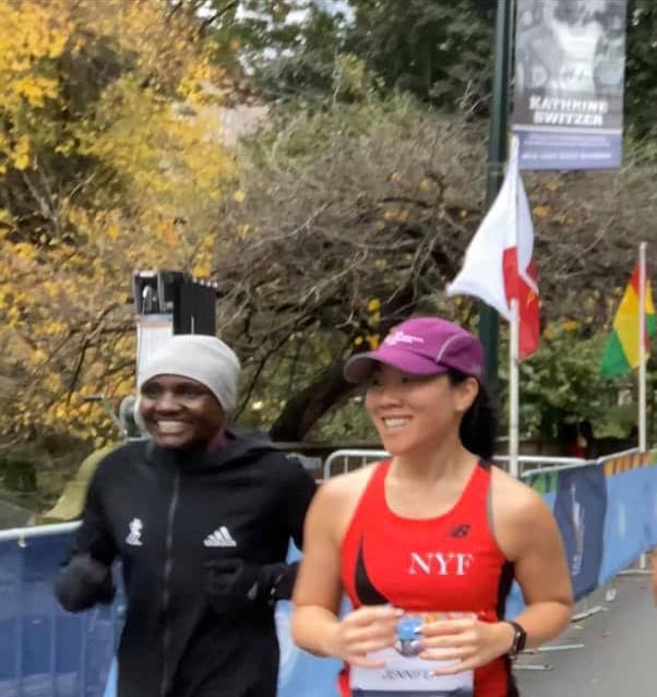Jennifer Pyun running alongside Joyciline Jepkosgei