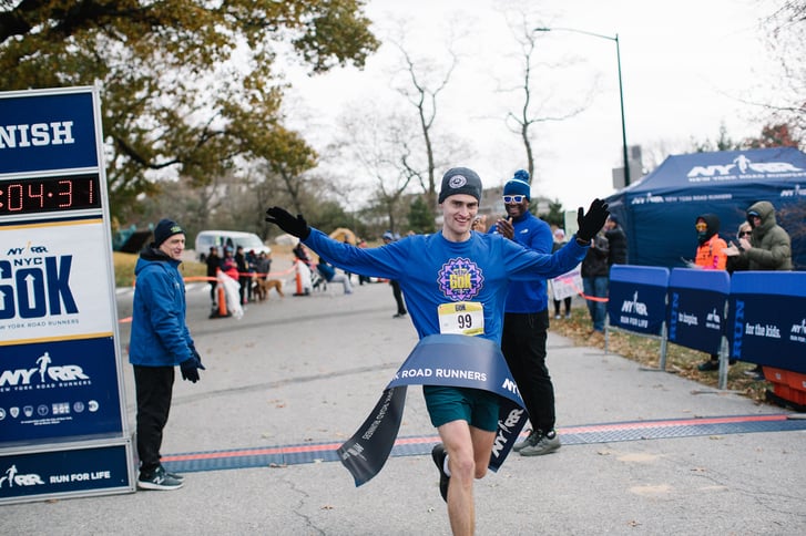 James Gorman breaking the tape at the NYRR NYC 60K
