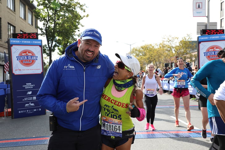 A Team for Kids finisher with Jim Heim, SVP, Event Development & Production, Race Director, TCS New York City Marathon