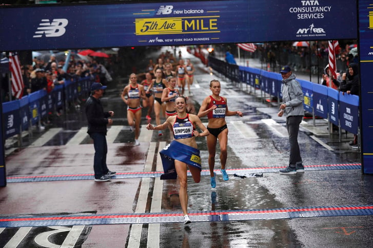 Jenny Simpson breaking the finish-line tape at the 2018 New Balance 5th Avenue Mile
