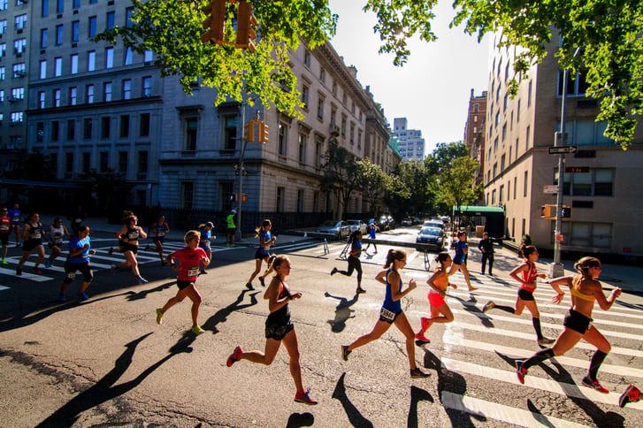 Runners in the sun in the New Balance 5th Avenue Mile