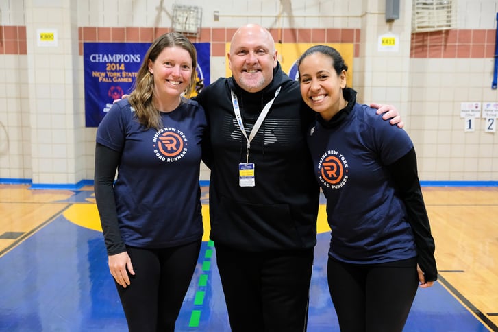 2019 Big Apple Award winner Doug Rebecca with NYRR's Caitlin Francisco and Lydia Gonzalez