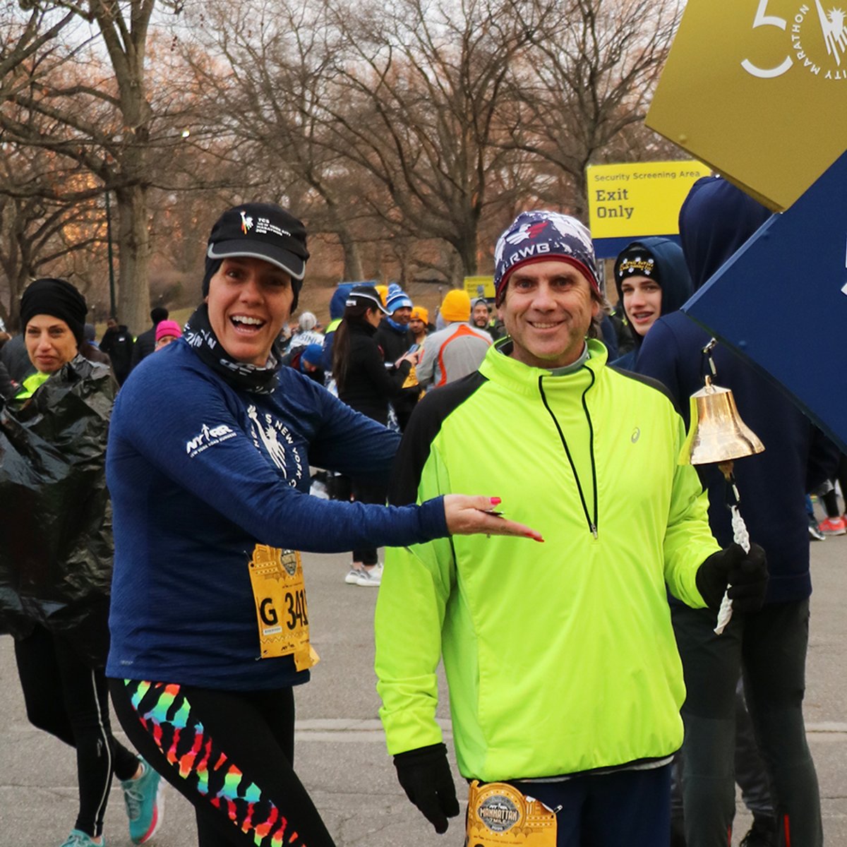 A runner ringing the 9+1 bell after a race