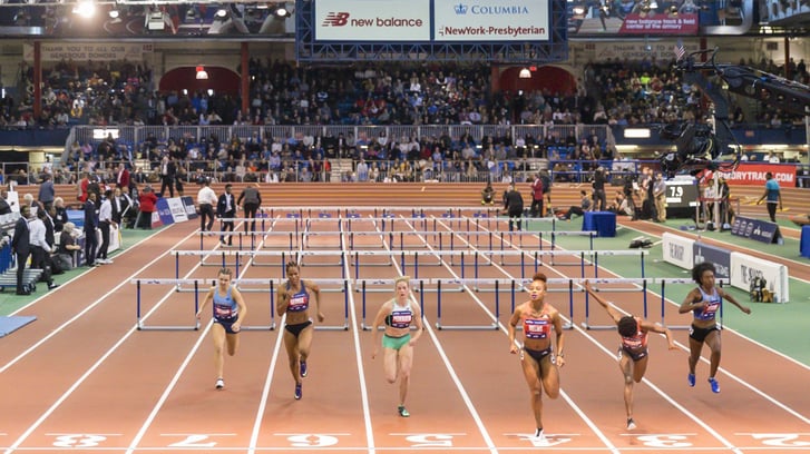 The end of a women's hurdle race in The Armory track